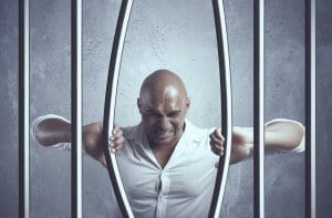 prisoner bending bars in jail in st. louis city